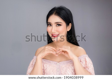 Beauty and healthcare. Portrait of young and beautiful asian woman on gray background