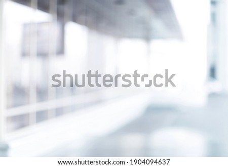 blurry image of an office with glass walls.
