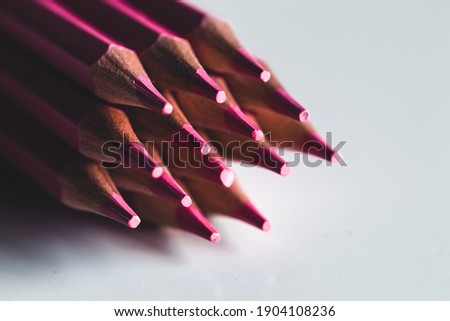 Pink pencils on a white background. Office, drawing.