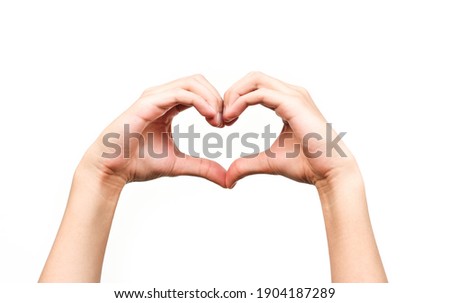 beautiful human hands giving heart signal on isolated white background Royalty-Free Stock Photo #1904187289