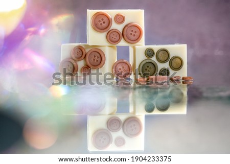 handmade soap with bubbles  on the table and sand and spice and coffee 