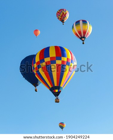 Beautiful hot air balloons over blue sky Royalty-Free Stock Photo #1904249224