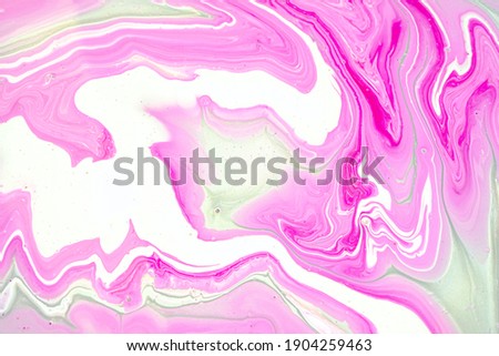 Fluid art texture. Closeup abstract pink, white and grey colors mixing of acrylic for use as background. Liquid acrylic artwork that flows and splashes with marble pattern. Valentine day concept