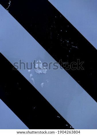 old black and white striped road metal sign
