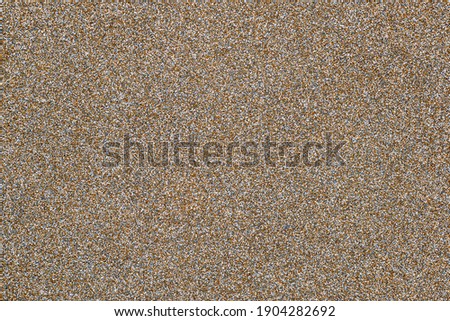 surface, stone plinth spatula made of small stones. Fine texture of small material