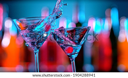 Martini cocktails, bar backround, close up. Cheers concept. Royalty-Free Stock Photo #1904288941