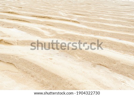 Beautiful abstract pattern with yellow sand background for wallpaper design. Summer sand beach background. Abstract background. Beautiful beach.