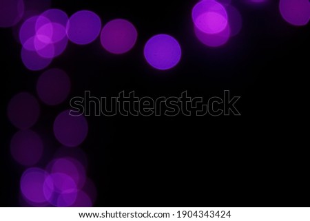 Purple lights bokeh abstract background with space for text. Colorful circles wallpaper. Copy space.