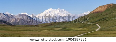 Denali, also referred to simply as "The Mountain", is the crown jewel of Denali National Park. As North America's highest peak it is an impressive sight not only in height but also sheer mass.  Royalty-Free Stock Photo #1904389336