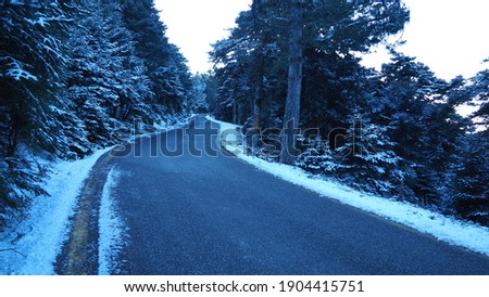 Beautiful snowed curvy mountain empty road