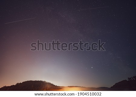 Milky Way, Jupiter and Saturn planets in the night sky.