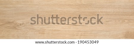 Wooden plank for texture background, long parquet or laminate board top view. Isolated light natural wood of oak tree with crack. Theme of grain, nature, wooden material, timber, woodgrain.