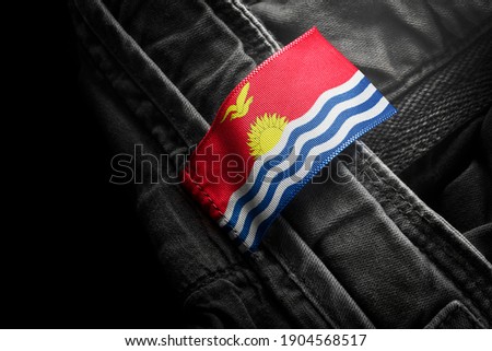 Tag on dark clothing in the form of the flag of the Kiribati