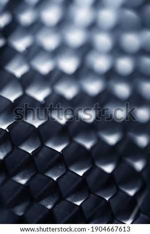 Closeup of abstract hi-tech surface with a honeycomb cells 