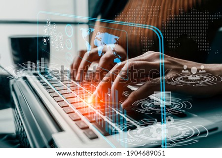 Double exposure of businesswoman hand touch on laptop computer with  business financial virtual chart, Digital network innovation and marketing concept, Blurred background.