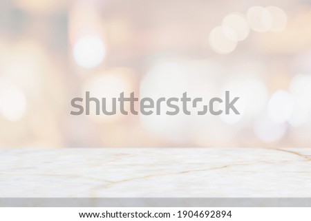 marble table top with blurred abstract cafe restaurant interior background Royalty-Free Stock Photo #1904692894