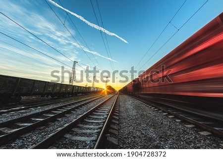 Train moves by rail, delivery of goods by freight train. Train carriages at the station Royalty-Free Stock Photo #1904728372