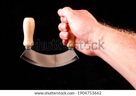 Photo Picture of a Kitchen Curved Metallic Knife Tool