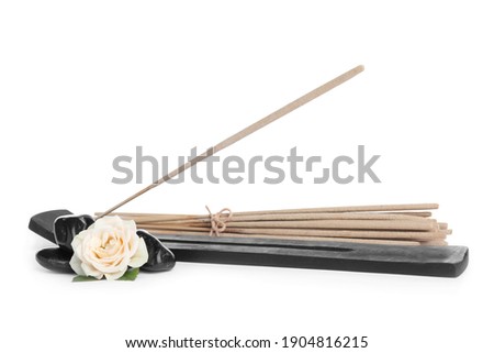 Composition with incense sticks and holder on white background Royalty-Free Stock Photo #1904816215