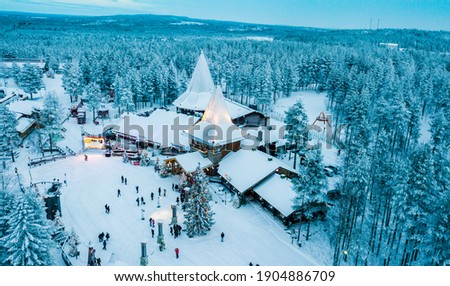 Aerial Santa Claus Holiday Village in Rovaniemi, Lapland during Winter Royalty-Free Stock Photo #1904886709