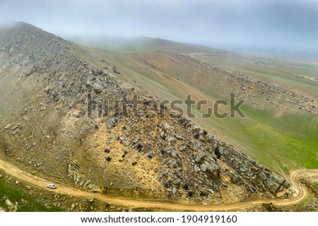 Foothills in late autumn in cloudy weather. Republic of Dagestan, southern Russia Royalty-Free Stock Photo #1904919160