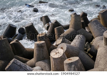 pile of wave breaker on glagah kulonprogo beach