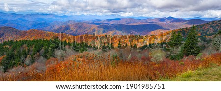 Beautiful autumn mountain panorama. Fall mountain scenery. A panoramic view of the Smoky Mountains from the Blue Ridge Parkway in North Carolina,USA. Image for banner or web header. Royalty-Free Stock Photo #1904985751