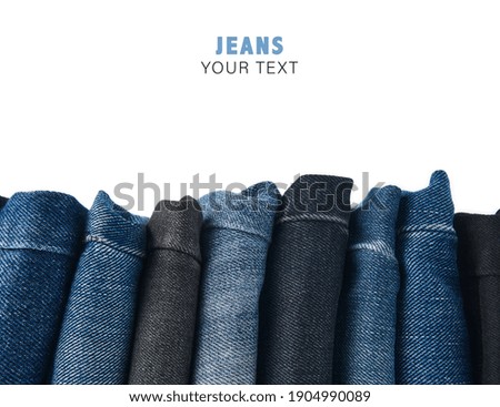 Stack of Various Shades Of Blue Jeans On White Background Denim jeans texture. Denim background texture for design. Canvas denim texture. Blue denim that can be used as background. Royalty-Free Stock Photo #1904990089