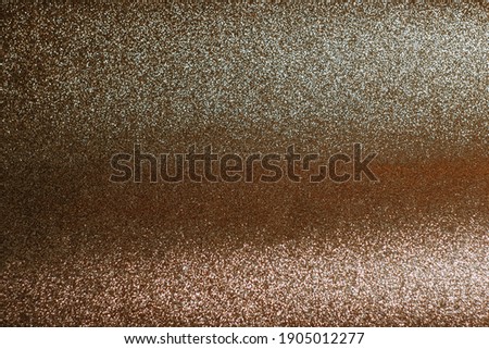 The background is golden beige. Champagne color. shiny background. Wave background. Glitter shine. Sparkling. Background. Typography.