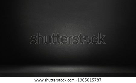 Black abstract cement wall and studio room , interior texture for display products. wall background.	