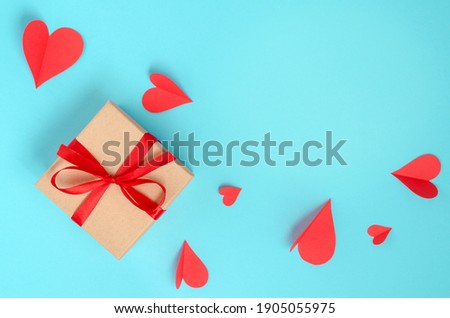 Background for Valentine's Day. Hearts, box, multicolored. Blue background with place for text. Celebrating Valentine's Day.	