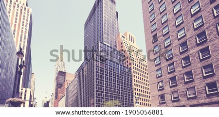 Retro stylized picture of old and modern New York City architecture, USA.