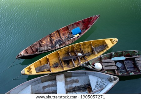 Close up of small fisherman wooden boat moored in port. located at Terengganu, Malaysia.
selective focus.