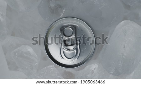 Aluminum Soda Tin Can Rotating in cool Ice motion closeup footage
