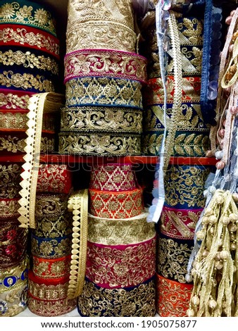 Beautiful Indian Lace borders for sale, for use in fashion design for women dress. Female Clothing Fashion design elements from the shelf of a fashion store. Indian fashion wear concept.
