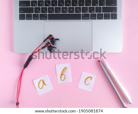 Banner with english abc, pen, notebook, wireless headphones for online courses. Education concept