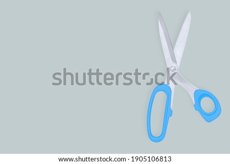 Scissors seamless pattern. Barber scissors against gray background backdrop.