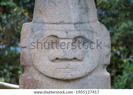 Stone sculpture or anthropomorphic statue from ancient pre-hispanic indigenous cultures in the Archeological park of San Agustin. Zoomorphic design