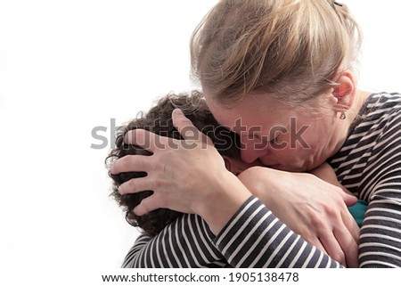 mother with child crying on white background stock photo