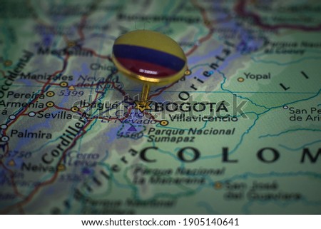 Bogota pinned on a map with the flag of Colombia