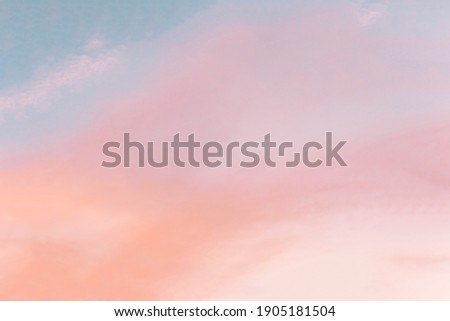 Background formed by a bright pastel authentic sky during sunset. Pink, peach, blue blur elegant backdrop with empty space perfect for design . Light color gradient transitions. Royalty-Free Stock Photo #1905181504