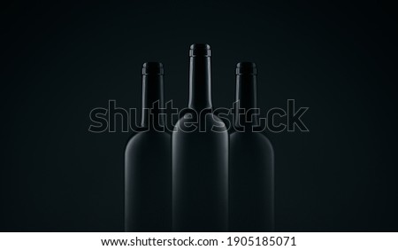 Three bottles of red wine, dark glass bottle without label mock up, black background with copy paste