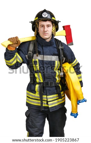 Young brave man in uniform and hardhat of firefighter holds axe and fire hose in hands and looking at camera isolated on white background