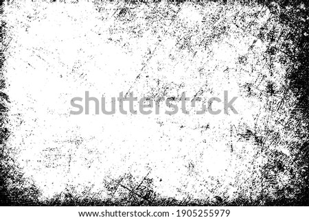 The grunge texture is black and white. Monochrome abstract background. Pattern of scratches, chips, and paint strokes. Black smudges, scuffing, wear and tear Royalty-Free Stock Photo #1905255979