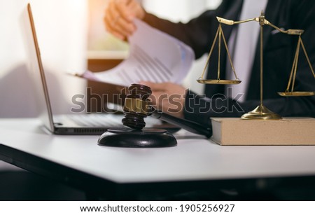Judge gavel with Justice lawyers having team Concepts of Law and Legal services Royalty-Free Stock Photo #1905256927