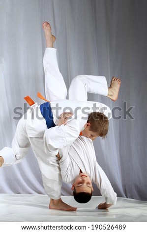 High throw techniques nage-waza are training athletes in judogi Royalty-Free Stock Photo #190526489