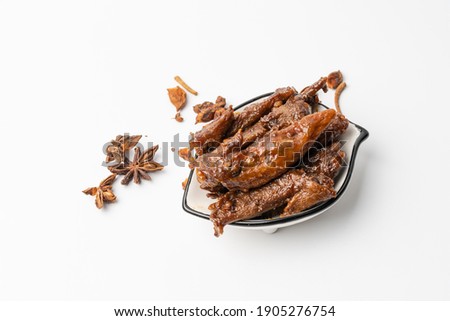 Spicy duck wing tips on a pure white background