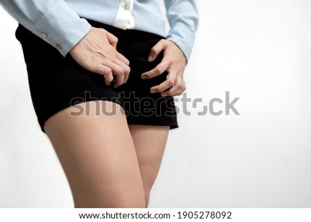 Female people scratching crotch with leucorrhoea,vaginitis,burning itchy genital,vaginal itching and unpleasant smell,problems of bacterial vaginosis,leukorrhea,gynecological and health care concept Royalty-Free Stock Photo #1905278092