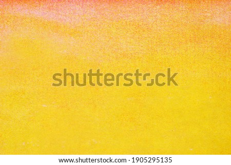 abstract background - colors on paper  surface, yellow and orange 