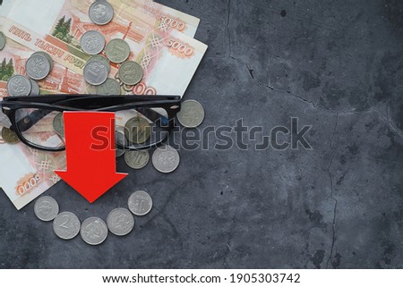 Russian money with the inscription "ruble". Economic crisis. The fall of the national currency. Volatility. The fall in pair ruble to dollar.
